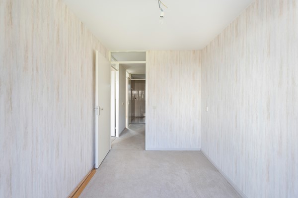 Foto - Te koop: Ruime dubbele benedenwoning met parkeerplaats!